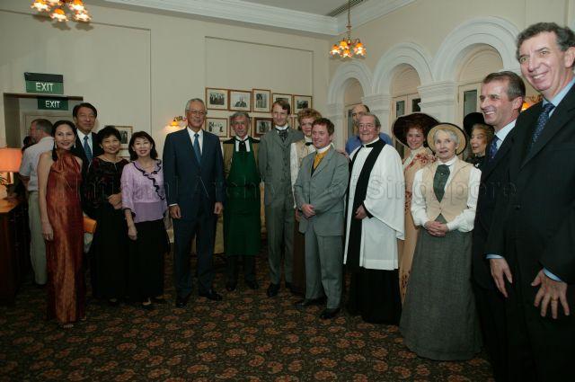 British Theatre Playhouse's Director Cecilia Leong-Faulkner (left), Minister for Defence Rear Admiral Teo Chee Hean and his wife, Senior Minister and Mrs Goh Chok Tong, British High Commissioner to Singapore and British Theatre Playhouse's Distinguished Parton Sir Alan Collins (far right) with the cast of Oscar Wilde's "The Importance of being Earnest" posing for a group photograph during its opening night at Raffles Hotel