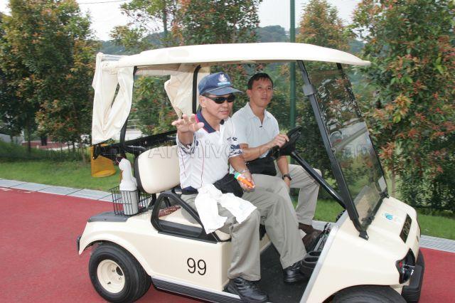 Two players in a golf buggy at Keppel Club, Bukit Chermin Road, during Keppel Club Centennial Invitational Golf. Guest of Honour at the event was Senior Minister Goh Chok Tong.