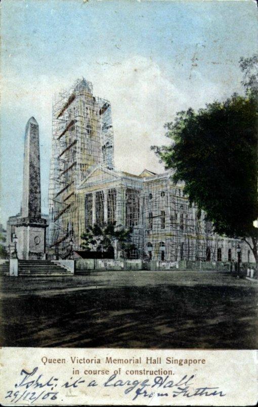 Victoria Memorial Hall and clock tower under construction. The Dalhousie Obelisk (left) was moved to a new site at the northern approach to Anderson Bridge in 1910 and then to its current site at Empress Place in 1911, after opening of the Bridge.