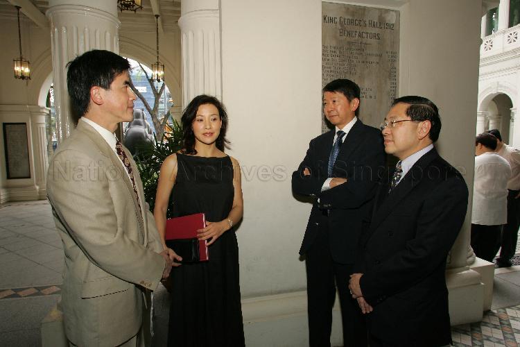 Permanent Secretary for Information, Communications and the Arts Dr Tan Chin Nam (second from right) having a chat with Chairman of the National Arts Council Lee Suan Hiang (right), actress Joan Chen (second from left) and her husband Dr Peter Hui (left) at the official opening of "Russel Wong: Photographs (1980-2005)" exhibition at the Glass Hall at the Singapore Art Museum