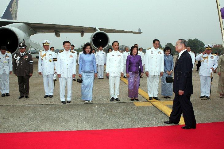 His Majesty King Bhumibol Adulyadej (in suit) of Thailand, Prime Minister of Thailand Dr Thaksin Shinawatra (fourth from left) and his wife, Potjaman Damapong (fifth from left) with other officials at the Royal Thai Air Force Base next to Bangkok's Don Muang Airport to welcome President and Mrs S R Nathan who are arriving for a five-day state visit to Thailand