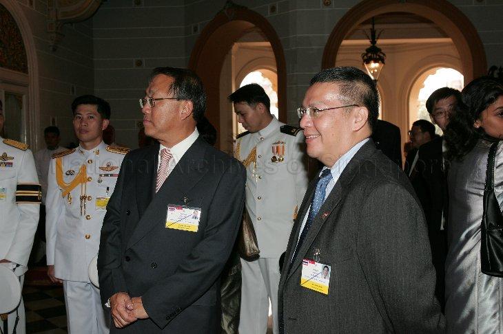 Singapore's Ambassador to Thailand Chan Heng Wing (left) and President S R Nathan's son-in-law Cheong Gay Eng, who is accompanying President and Mrs S R Nathan on a five-day state visit to Thailand, standing outside Boromabiman Mansion within the Grand Palace