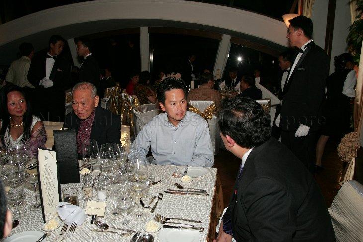 Ms Claire Chiang (wife of Executive Chairman of Banyan Tree Holdings Ho Kwon Ping), CapitaLand Deputy Chairman Hsuan Owyang and Member of Parliament for Tampines Group Representation Constituency (GRC) Ong Kian Min (right), who are members of President S R Nathan's entourage on a five-day state visit to Thailand, attending dinner at Banyan Tree Hotel, Bangkok