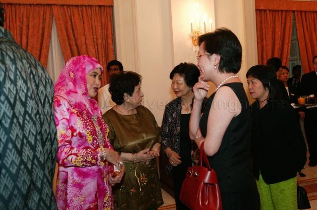Wife of Sultan of Brunei Raja Isteri Pengiran Anak Hajjah Saleha and Mrs Helen Yeo, wife of Minister for Transport Yeo Cheow Tong, talking during dinner for His Majesty Sultan Haji Hassanal Bolkiah Mu'izzaddin Waddaulah of Brunei hosted by President S R Nathan at Istana. The Sultan, accompanied by his wife and family, was in Singapore to receive an honorary Doctor of Laws degree from National University of Singapore (NUS) for his achievements in leading his country and his outstanding contributions to Singapore-Brunei relations.