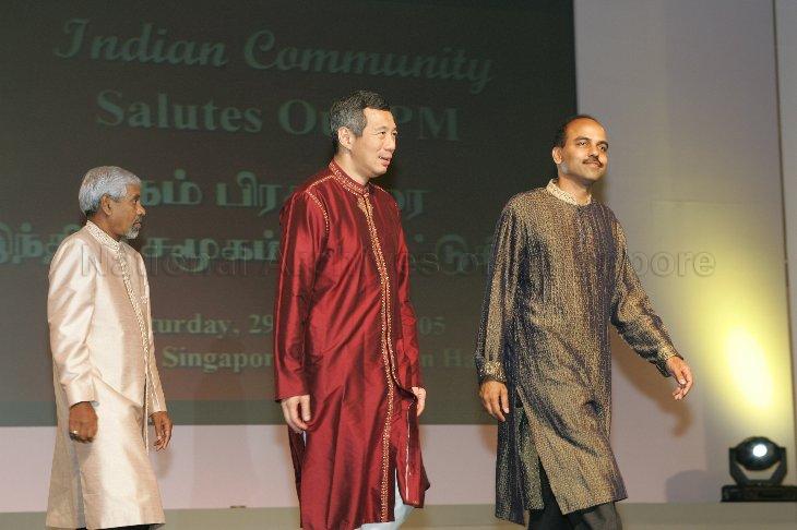 (From left) Chairman of the Indian Chamber of Commerce and Industry M Rajaram, Prime Minister (PM) Lee Hsien Loong and Chairman of Narpani Pearavai P Thirunal Karasu making their way down the stage after gift presentation at Indian community tribute dinner for PM at Suntec Convention Hall