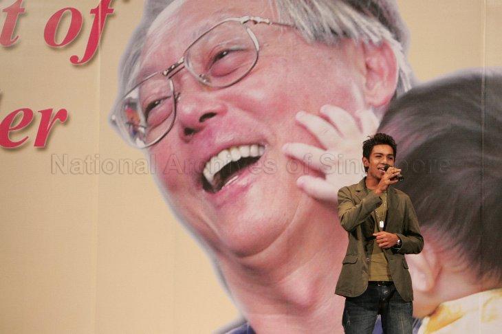 Taufik Batisah, winner of first season of the reality television series Singapore Idol (2004), performing a song during the Malay/Muslim community's tribute high tea for Senior Minister Goh Chok Tong in the Raffles Ballroom at Raffles City Convention Centre Pictured: Artwork of Senior Minister Goh Chok Tong
