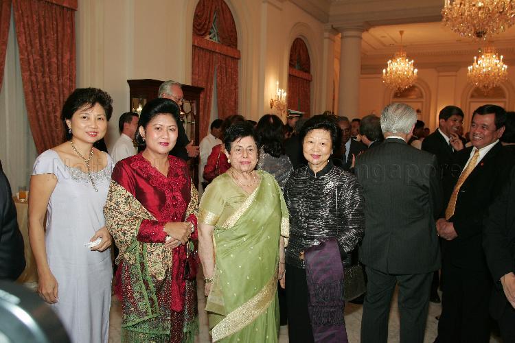 (From left) Chew Poh Yim, wife of Minister for Defence Teo Chee Hean, Mrs Ani Bambang Yudhoyono, Mrs Nathan, wife of President S R Nathan and Mrs Mary Tan, wife of Deputy Prime Minister and Co-ordinating Minister for Security and Defence Dr Tony Tan Keng Yam posing for a photograph during the state banquet hosted for President Susilo Bambang Yudhoyono of Indonesia by President S R Nathan at the Istana Banquet Hall. Accompanied by a high-level ministerial delegation, Indonesian President Susilo Bambang Yudhoyono was in Singapore for a two-day state visit Pictured: Deputy Prime Minister and Co-ordinating Minister for Security and Defence Dr Tony Tan Keng Yam (back facing camera), Senior Minister Goh Chok Tong (partially hidden)
