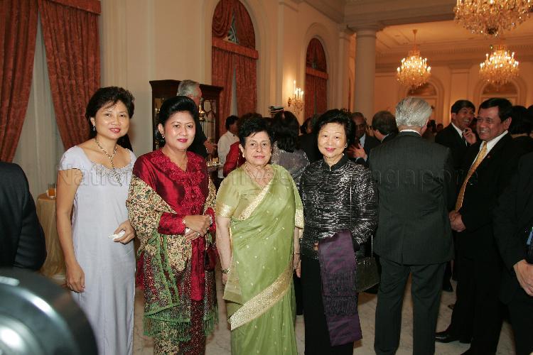 (From left) Chew Poh Yim, wife of Minister for Defence Teo Chee Hean, Mrs Ani Bambang Yudhoyono, Mrs Nathan, wife of President S R Nathan and Mrs Mary Tan, wife of Deputy Prime Minister and Co-ordinating Minister for Security and Defence Dr Tony Tan Keng Yam posing for a photograph during the state banquet hosted for President Susilo Bambang Yudhoyono of Indonesia by President S R Nathan at the Istana Banquet Hall. Accompanied by a high-level ministerial delegation, Indonesian President Susilo Bambang Yudhoyono was in Singapore for a two-day state visit Pictured: Deputy Prime Minister and Co-ordinating Minister for Security and Defence Dr Tony Tan Keng Yam (back facing camera), Senior Minister Goh Chok Tong (partially hidden)