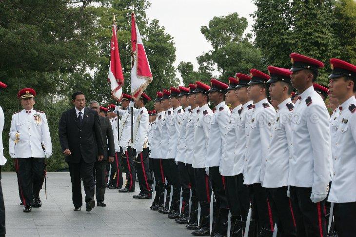 President Susilo Bambang Yudhoyono of Indonesia, accompanied by President S R Nathan (partially hidden), reviewing guard of honour during ceremonial welcome at The Istana. The Indonesian President was on a two-day state visit to Singapore.