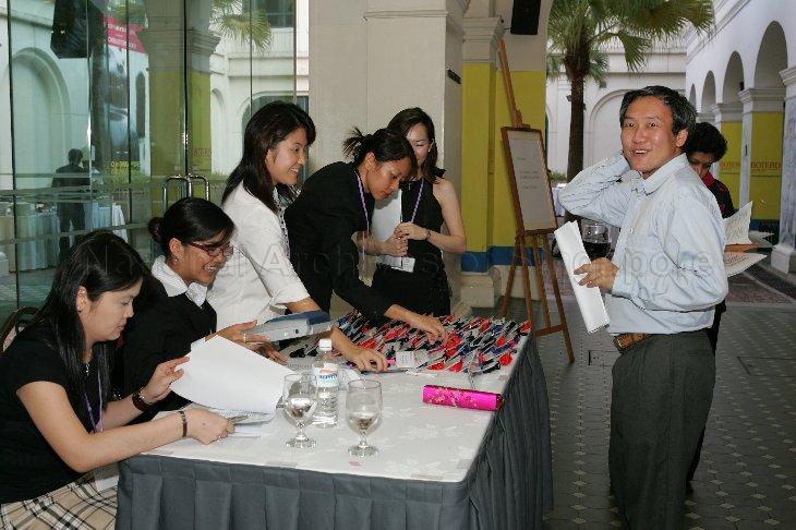 Director of National Archives of Singapore Pitt Kuan Wah at the registration table during the Annual Thank You Dinner reception held in Singapore Art Museum