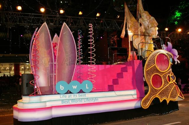 Float sponsored by "BWL Singapore" distributor of health and wellness products driving through Orchard Road during Chingay 2005 procession. Chingay 2005 with the theme 'Parade of Dreams' was attended by Guest-of-Honour President S R Nathan and his wife.
