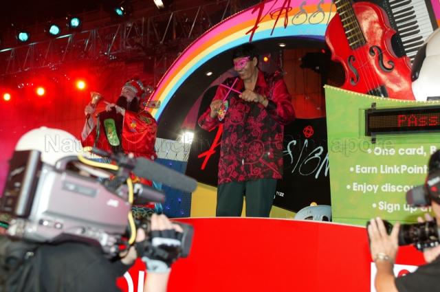 Float featuring "PAssion Card" a community privilege card issued by People's Association (PA) at Chingay 2005 procession at Orchard Road. Chingay 2005 with the theme 'Parade of Dreams' was attended by Guest-of-Honour President S R Nathan and his wife.