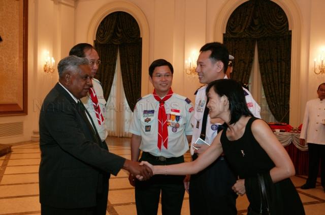 President and Singapore's Chief Scout S R Nathan greeting wife of recipient of Chief Scout's Commendation Edwin Lye Teck Hee (second from right) during Scouts Good Service Awards 2004 Ceremony at Istana State Room. Looking on are Deputy Chief Commissioner of Singapore Scout Association (SSA) Tan Cheng Kiong (third from right) and Chief Commissioner of SSA Nicholas Tang.