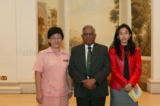 President and Singapore's Chief Scout S R Nathan and recipient of Bronze Vanda Award Mrs Lim Kian Huat (left) posing for a photograph during Scouts Good Service Awards 2004 Ceremony at Istana State Room