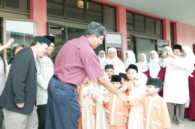 Students of Mujahidin Mosque Kindergarten giving Minister for the Environment and Water Resources Associate Professor Dr Yaacob Ibrahim a send-off after his visit to the Mosque at Stirling Road. The Minister was on a community visit to Queenstown Division of Tanjong Pagar Group Representation Constituency (GRC) Pictured: Executive Chairman of the Mosque Muhammad Khairul Jameel Bin Yahya