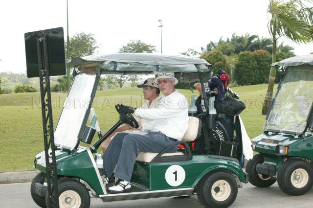Guest-of-Honour Senior Minister Goh Chok Tong driving the golf buggy with Chairman of Singapore Business Federation Stephen Lee seated on the left during Loving Heart Fund-Raising Golf Tournament held at Orchid Country Club in aid of Loving Heart Multi-Service Centre (Jurong Central)