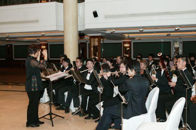 The Mus'Art Wind Orchestra (under the wing of Jurong Green Community Club) performing under Music Director Madam Tan Soh Hwa at Orchid Country Club in conjunction with the Loving Heart Fund-Raising Golf Tournament in aid of Loving Heart Multi-Service Centre (Jurong Central) where Senior Minister Goh Chok Tong was Guest-of-Honour