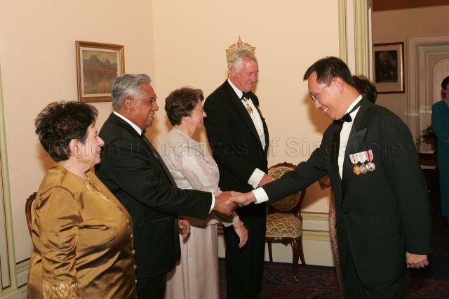 President and Mrs S R Nathan with hosts, Governor of Tasmania William Cox and wife Mrs Jocelyn Cox, receiving Singapore High Commissioner to Australia Joseph Koh Kok Hong and wife during state dinner at Government House, Hobart, Tasmania. President and Mrs Nathan are on a six-day official state visit to Australia from March 13th to 18th.