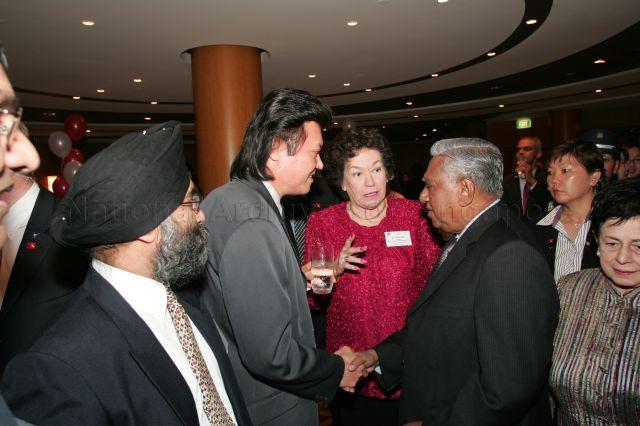 Mrs Cecilia Wee (in red), wife of former Chief Justice Wee Chong Jin introducing guest to President S R Nathan during cocktail reception hosted by the Western Australia Singapore Business Council and Singapore-Western Australia Network at Terrace Ballroom, Hyatt Regency Perth Hotel. President and Mrs Nathan are on a six-day official state visit to Australia from March 13th to 18th.