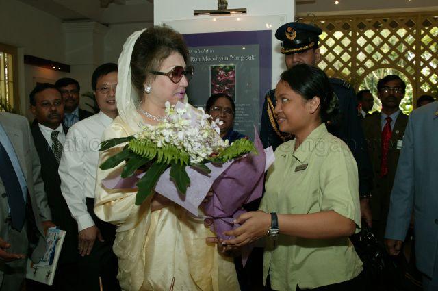 Bangladeshi Prime Minister Begum Khaleda Zia, who is on a three-day official visit to Singapore, being presented with a bouquet of orchids during visit to National Orchid Garden located within Singapore Botanic Gardens