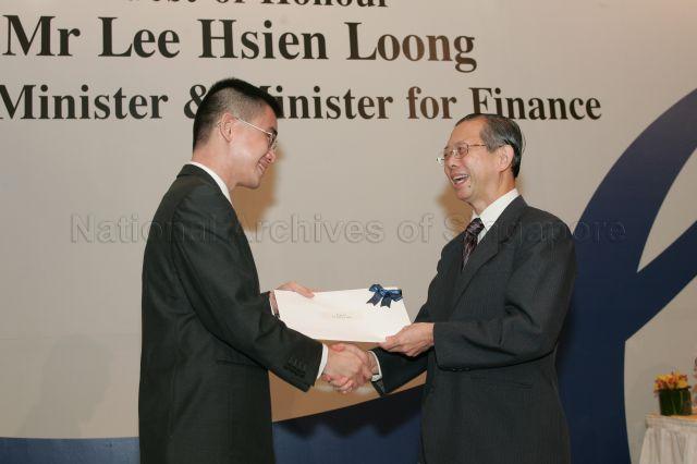 Permanent Secretary to Ministry of Finance and outgoing Head of Civil Service Lim Siong Guan presenting certificate of appointment/promotion to Director (Strategic Planning), Lee Kuan Yew School of Public Policy, National University of Singapore, Dr Francis Chong Fu Shin during annual dinner for the Administrative Service, the Civil Service's elite wing, at Conrad Centennial Singapore. Guest of Honour at the dinner was Prime Minister and Minister for Finance Lee Hsien Loong.