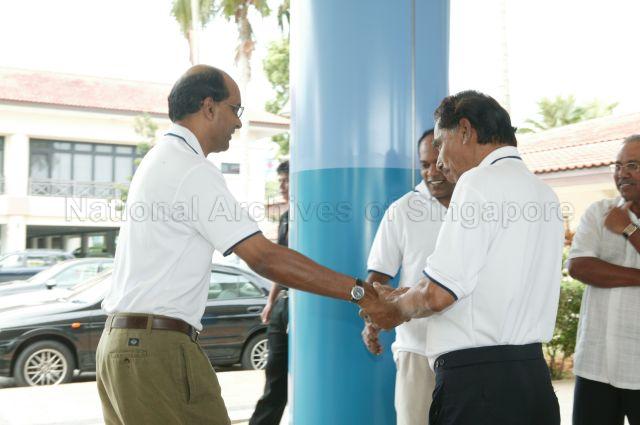 Minister for Education Tharman Shanmugaratnam (left) being welcomed by Member of Parliament for Sembawang K Shanmugam (centre) and Chairman of the Hindu Endowments Board (HEB) V R Nathan (right) upon his arrival for HEB's family day cum awards ceremony at National Trades Union Congress (NTUC) Club, Downtown East which is attended by guest of honour President S R Nathan