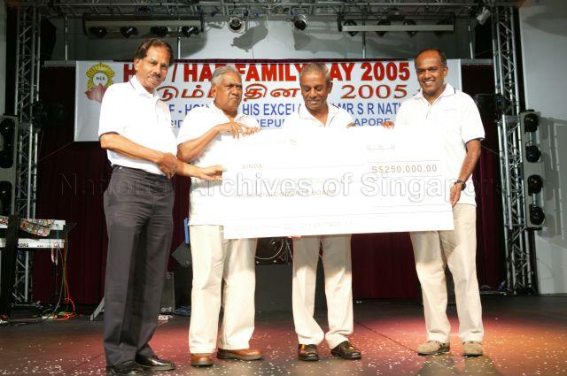 From left, Chairman of Hindu Endowments Board (HEB) V R Nathan, guest of honour President S R Nathan, Deputy Prime Minister and Minister for Law Professor S Jayakumar, &nbsp;and Member of Parliament for Sembawang K Shanmugam holding the cheque of $250,000 raised by temples under HEB for Singapore Indian Development Association (SINDA) during HEB's family day cum awards ceremony at National Trades Union Congress (NTUC) Club, Downtown East