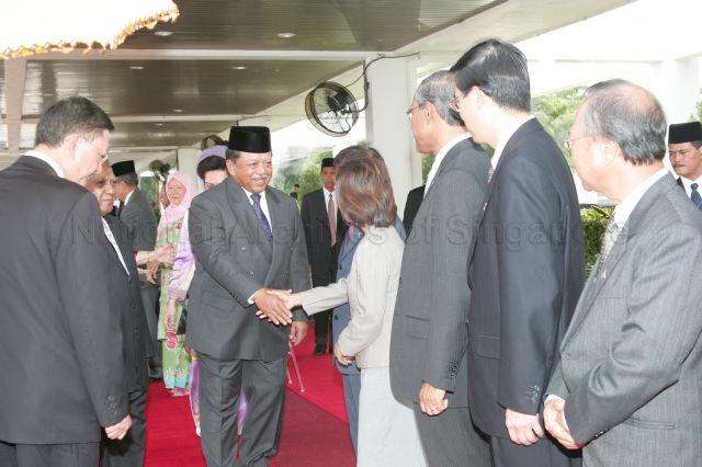 Yang Di-Pertuan Agong of Malaysia Tuanku Syed Sirajuddin (centre) being introduced to Mrs Khaw Boon Wan, wife of Minister for Health, in Kuala Lumpur during President and Mrs S R Nathan's five-day state visit to Malaysia from April 11- 15