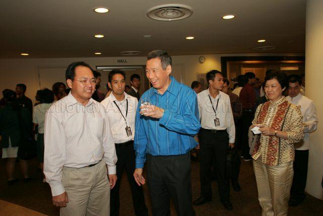 Prime Minister Lee Hsien Loong with grassroots leader Liang Eng Hwa at the reception during National Day Rally at University Cultural Centre, National University of Singapore. On the right is Madam Ho Ching, wife of Prime Minister Lee Hsien Loong