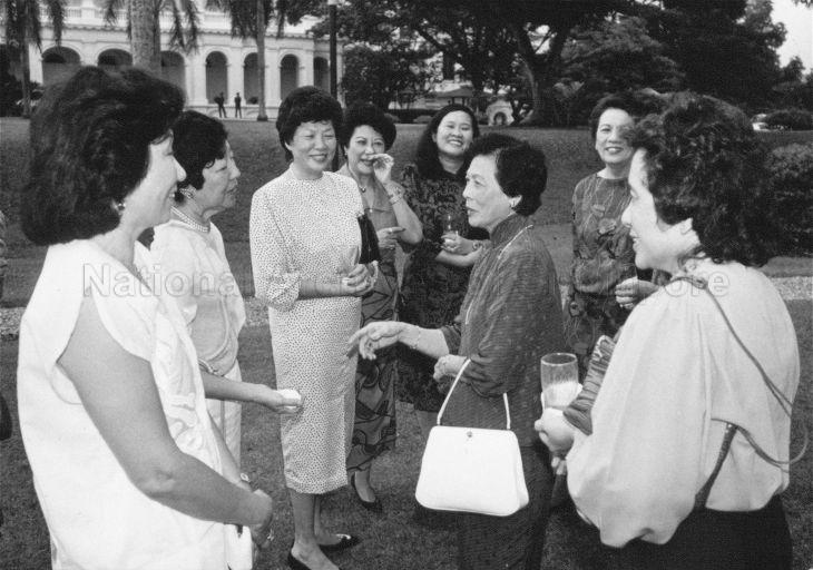 First Lady Mrs Wee Kim Wee talking with guests during Istana garden party held for members or management committee of Medical Academy of Singapore, College of General Practitioner, Keppel Club, Singapore Island Country Club, Tanah Merah Country Club, Tanah Merah Country Club, Sentosa Golf Club and Ministry of Health officials and Government Parliamentary Committee for Health