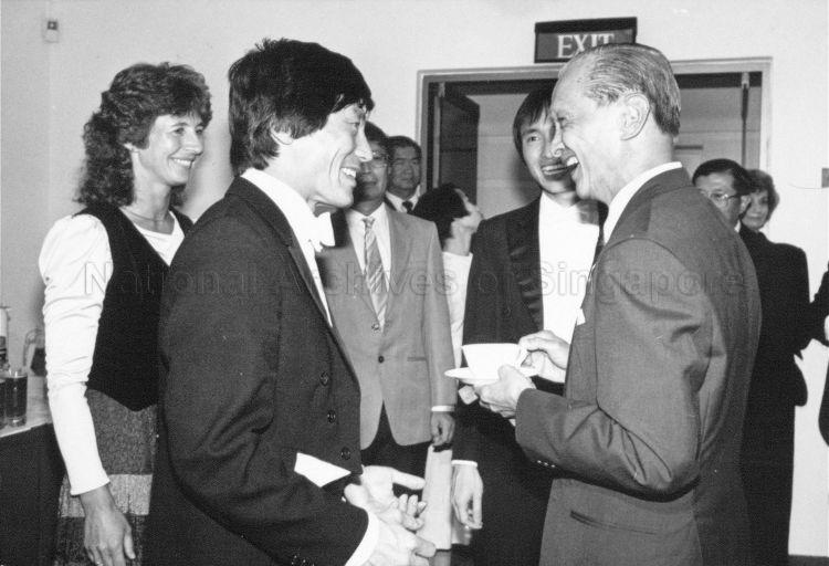 President Wee Kim Wee in conversation with Singapore-born violinist Lee Pan Hon (left) and pianist Seow Yit Kin (on President's right, partially hidden) during the Singapore Symphony Orchestra concert at Victoria Memorial Hall. The concert starts off the month-long Singapore Festival of Arts.