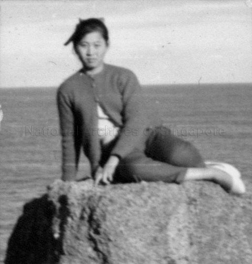South Australia, 1956. Ling Siew Lian, younger sister of Ling Siew May, on a boulder by the sea