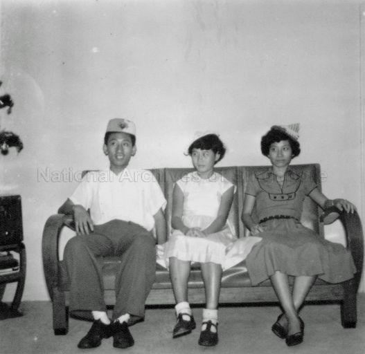 Ling Siew May (right) with younger sister Siew Lian and older brother Ling during a party at their parents home.