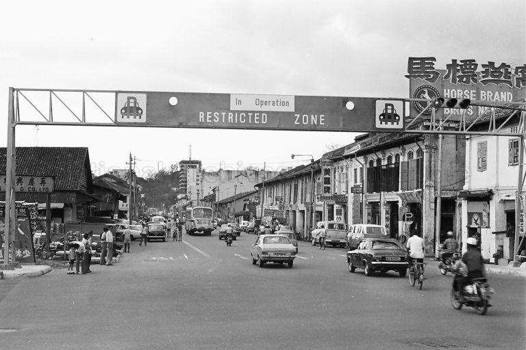 "Restricted Zone in Operation" sign at Bencoolen Street was built under the Area Licensing Scheme (ALS) in 1975 to manage traffic congestion, and was replaced by Electronic Road Pricing (ERP) in 1998. OG Albert and Sim Lim Square now stand to the left and right of the overhead gantry.
