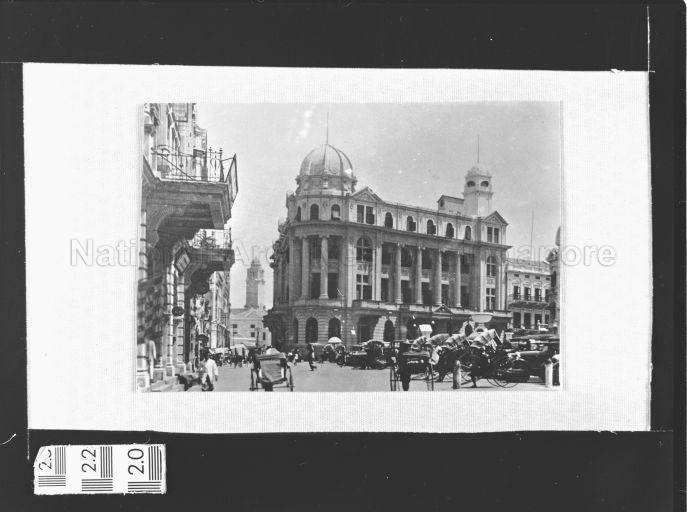 Chartered Bank Building, Battery Road, c.1920. At the far end on the left is clock tower of Victoria Memorial Hall. 