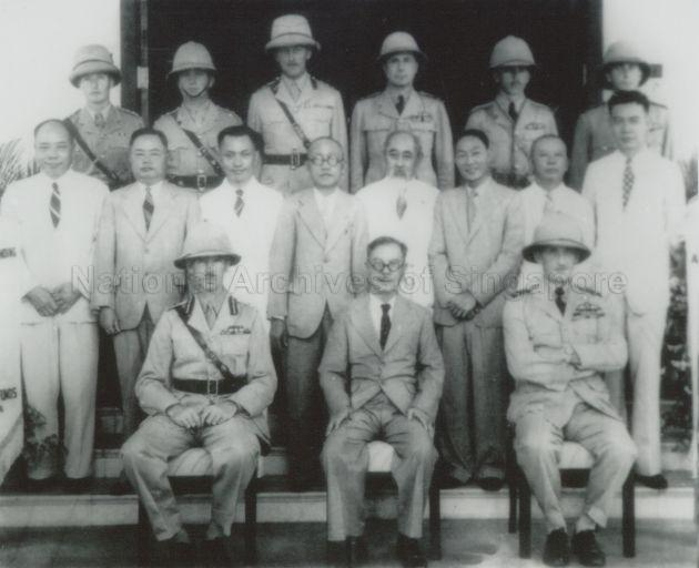 Group photograph of Tan Kah Kee, Singapore leaders and Malaya Army. This photograph was taken following the presentation of 'Victory' pennants by representatives of the Chinese Community to the General Officer Commanding (Malaya), Lt Gen Arthur Percival, and Air Officer Commanding (Far East), Air Vice-Marshal Conway Pulford, at Flagstaff House (now Command House), Kheam Hock Road, on 6 Sep 1941. Members of the Chinese Community present included Mr. Tan Kah Kee, Mr. Yong Yit Lin, Mr. Yang Sin Hua, Mr. Heah Wing Chew, Mr. Lee Choon Seng, Dr. Lim Boon Keng, Mr. Ching Kee Sun, Mr. Han Chiau Toon and Mr. Yap Pheng Geck.
