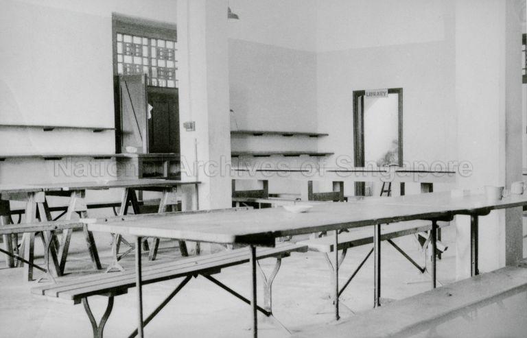 View of officers' mess in Roberts Barracks, part of the collection of prisoner of war (POW) camps in Changi, with doorway to the library in the background