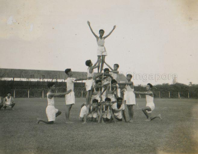 Boys of Singapore Boys' Brigade doing a human pyramid at their third annual review and display at Victoria School