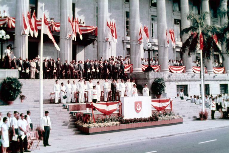 National Day Parade 1966 at the Padang - President Yusof Ishak and Cabinet Ministers on steps of City Hall reviewing the parade