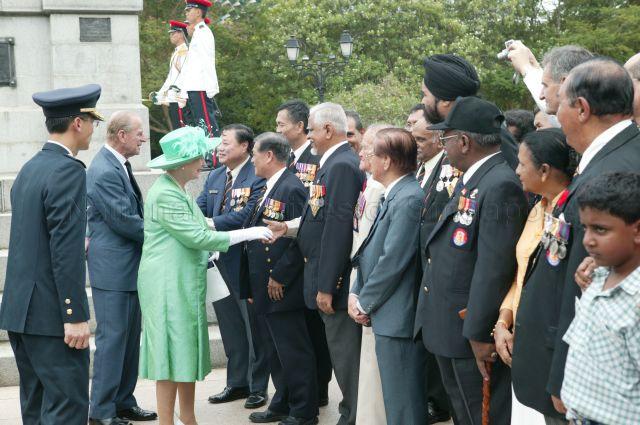 Queen Elizabeth II and Duke of Edinburgh Prince Philip meeting former servicemen and their family members after the wreath laying ceremony at Cenotaph