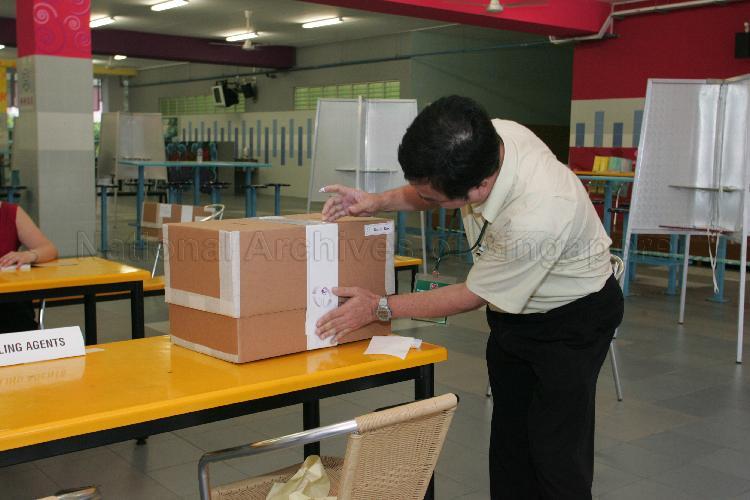 Sealing of ballot boxes before polling commences at Bedok