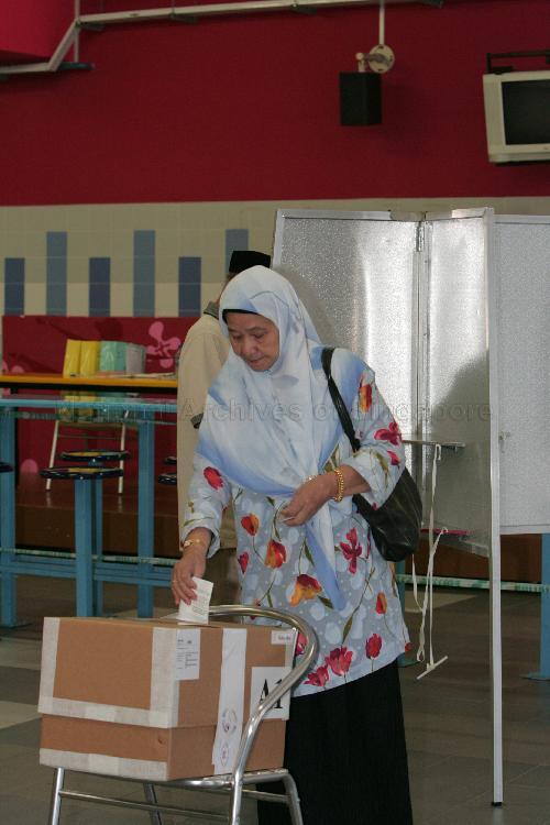 Voter casting her vote at the polling station situated in Bedok View Secondary School during Singapore General Election