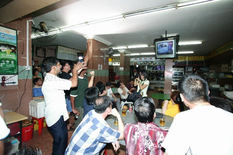 Singapore Democratic Alliance (SDA) supporters viewing live coverage of election results at Jin Biao Coffeeshop at Block 136, Potong Pasir Avenue 3. The coffeeshop was assembly centre for SDA and their supporters while waiting for election results during Singapore General Election.