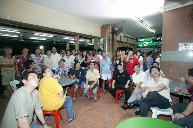 Singapore Democratic Alliance (SDA) supporters viewing live coverage of election results at Jin Biao Coffeeshop at Block 136, Potong Pasir Avenue 3. The coffeeshop was assembly centre for SDA and their supporters while waiting for election results during Singapore General Election.