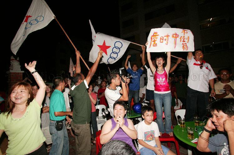 Gathering of Singapore Democratic Alliance (SDA) supporters outside Jin Biao Coffeeshop at Block 136, Potong Pasir Avenue 3. The coffeeshop was assembly centre for SDA and their supporters while waiting for election results during Singapore General Election.