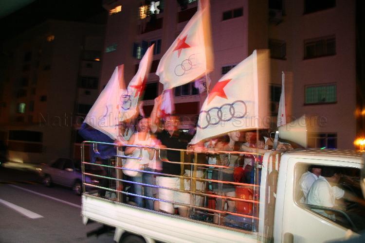Singapore Democratic Alliance (SDA) supporters in a mini truck moving along the street at Potong Pasir during Singapore General Election