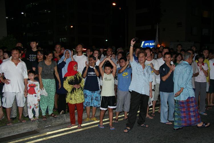 Singapore Democratic Alliance (SDA) supporters and onlookers in the street at Potong Pasir during Singapore General Election
