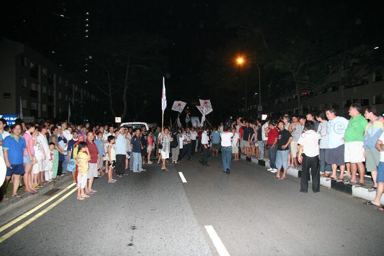 Singapore Democratic Alliance (SDA) supporters and onlookers in the street at Potong Pasir during Singapore General Election
