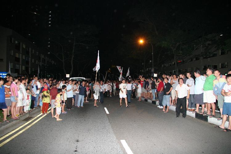 Singapore Democratic Alliance (SDA) supporters and onlookers in the street at Potong Pasir during Singapore General Election