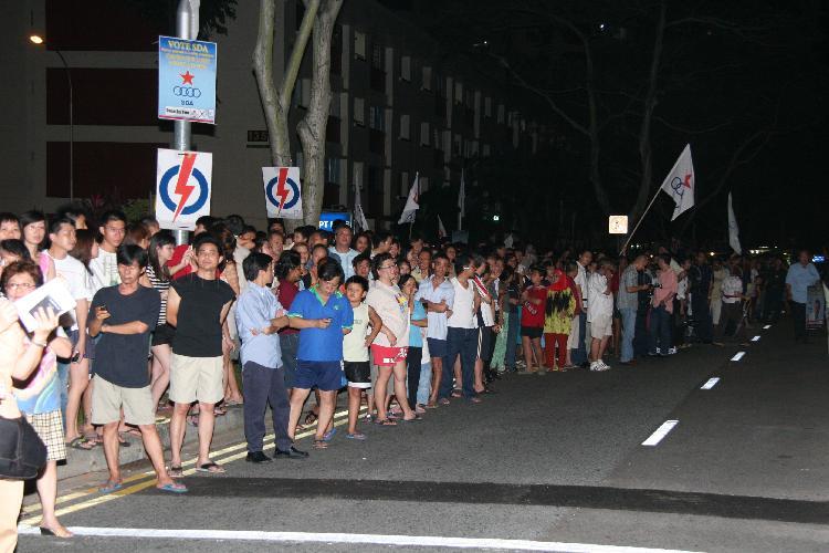 Singapore Democratic Alliance (SDA) supporters and onlookers in the street at Potong Pasir during Singapore General Election